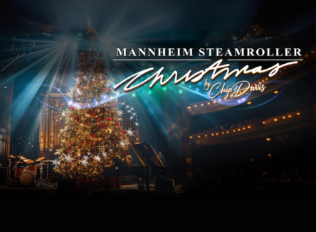 Christmas tree on stage with whimsical light beams coming from the tree. Text: Mannheim Steamroller Christmas by Chip Davis