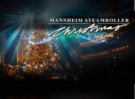 Christmas tree on stage with whimsical light beams coming from the tree. Text: Mannheim Steamroller Christmas by Chip Davis