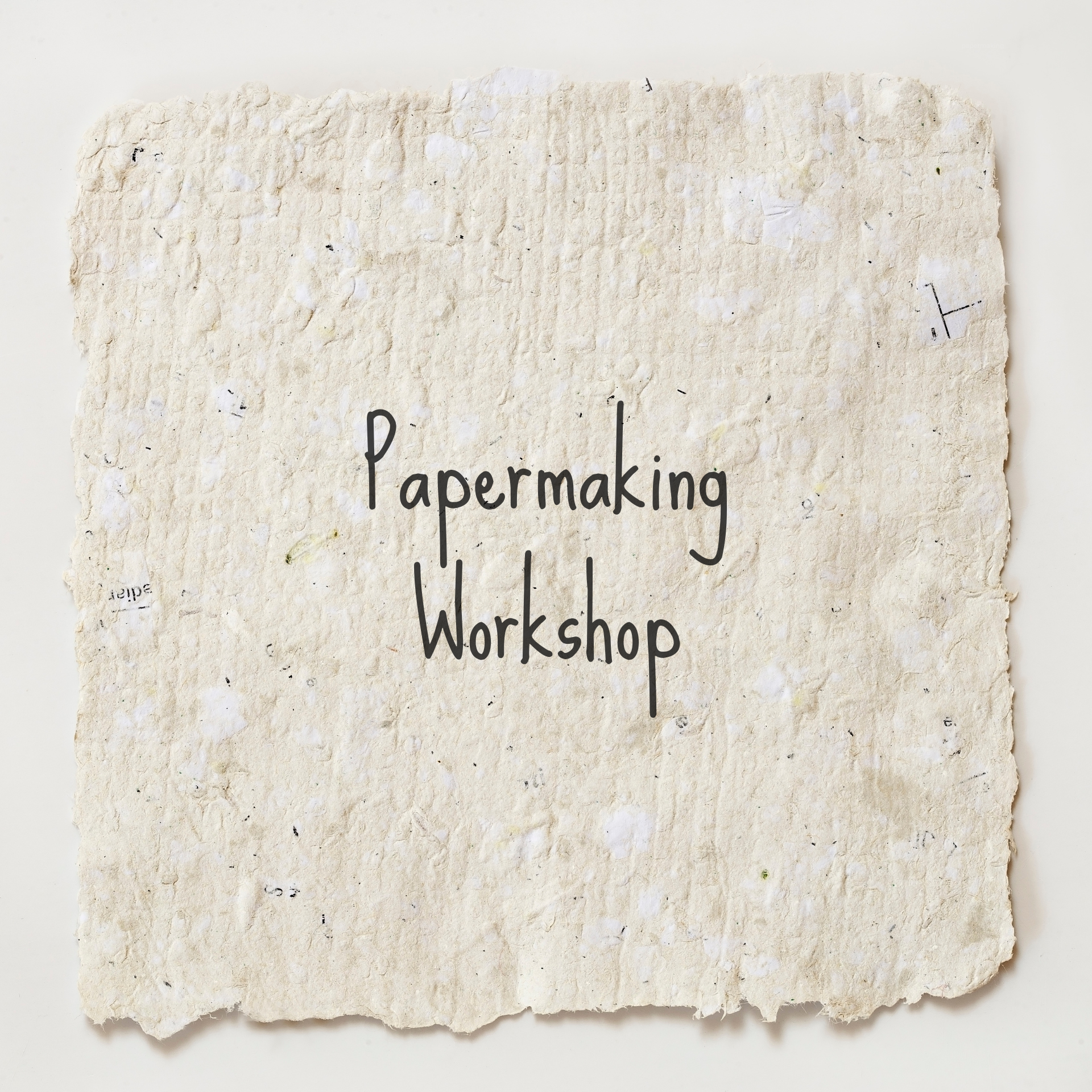 Paper making workshop text on top of homemade paper