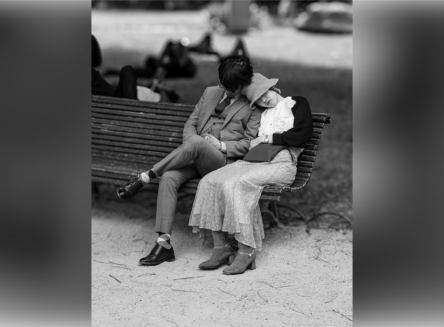 Paris Couple, by Jim Goudy couple in 1920s outfits sitting on park bench