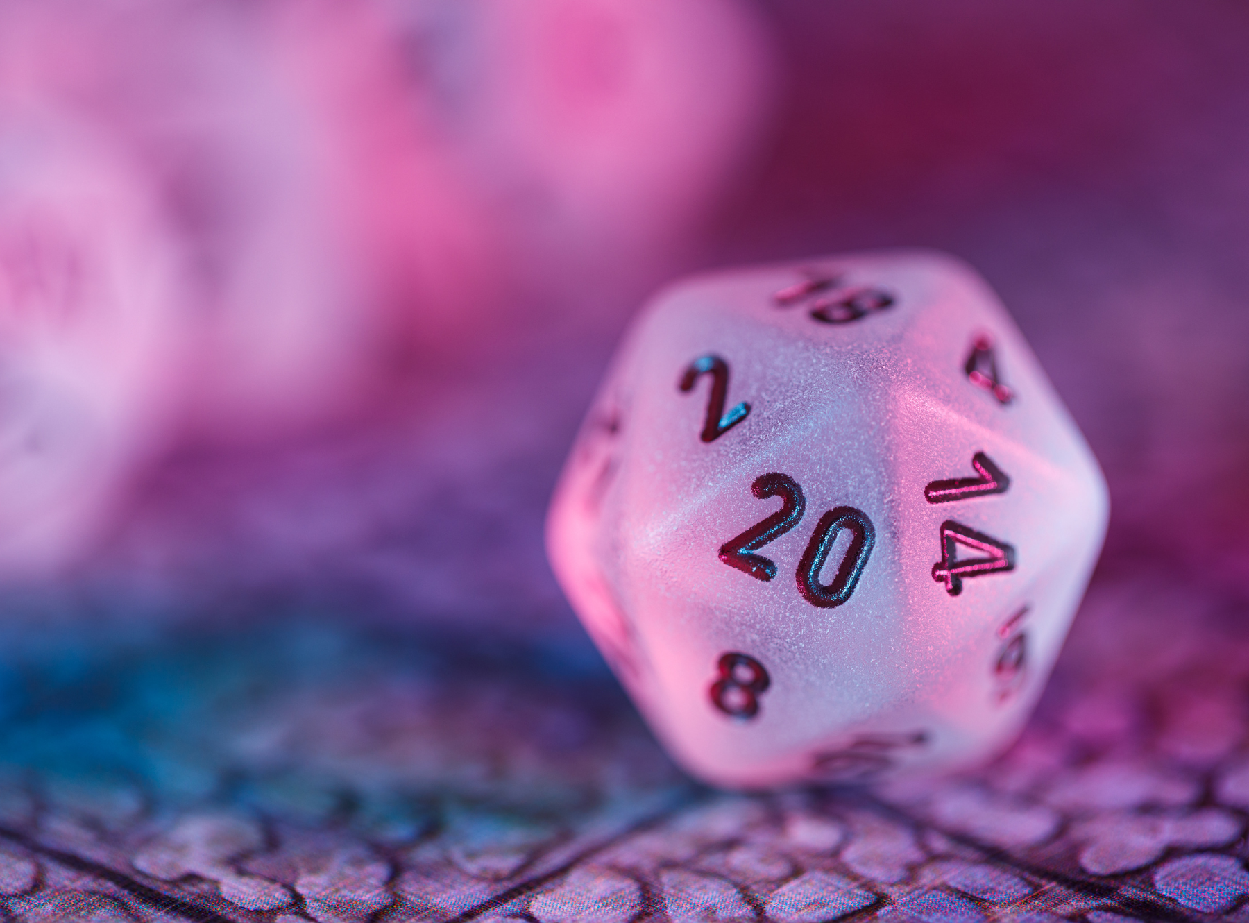 20 sided dice on top of game mat