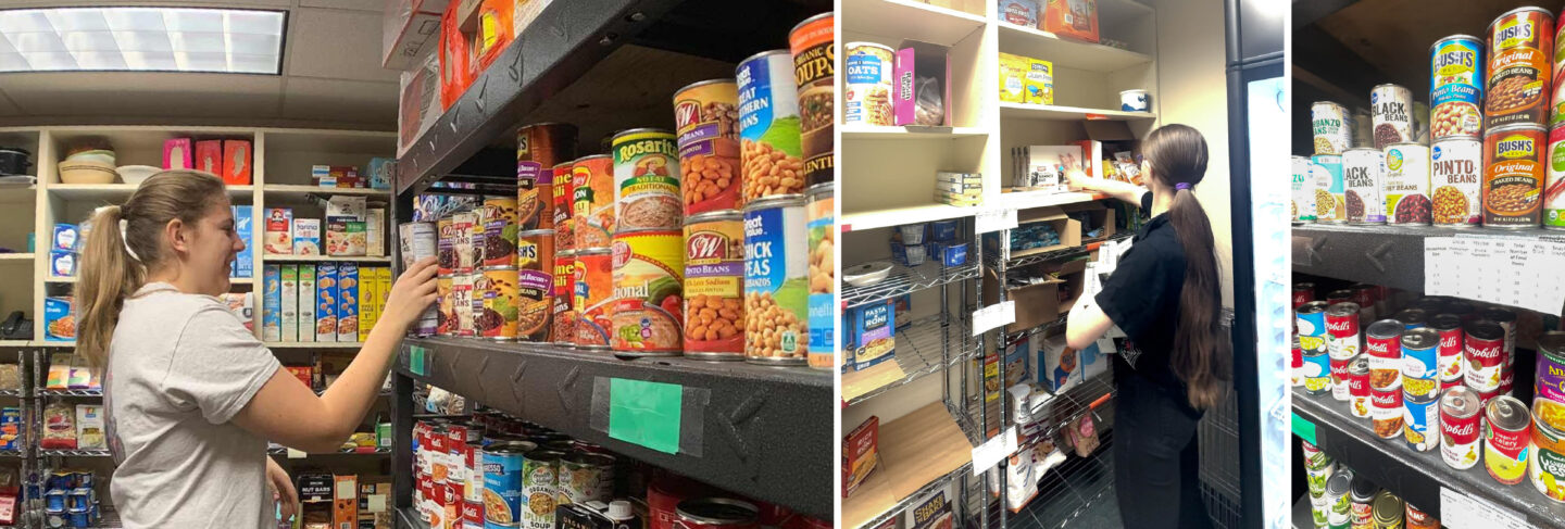 Volunteers organizing shelves filled with canned and packaged foods at a community food pantry.